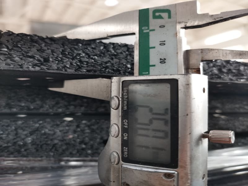 Freight truck delivering pallets of rubber flooring with a lift gate